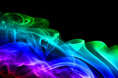 Colored smoke isolated on a black backgroundの写真素材