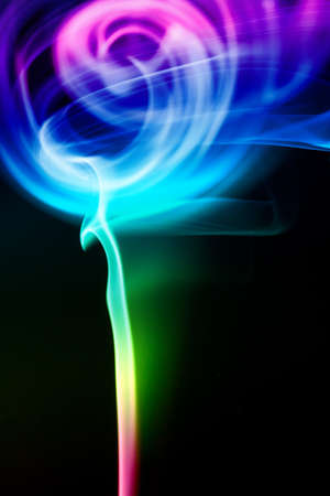 Colored smoke isolated on a black backgroundの写真素材