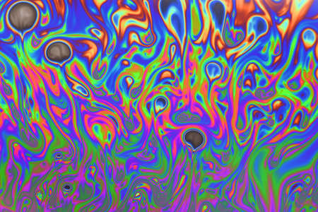 Colorful psychedelic abstract formed by light on the surface off a soap bubbleの写真素材