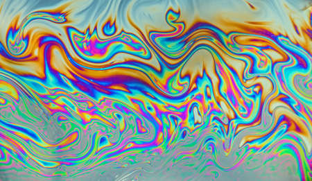 Psychedelic patters formed on the surface of a soap bubbleの写真素材