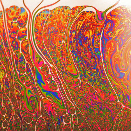 Psychedelic abstract formed by light interference on the surface of a soap bubbleの写真素材