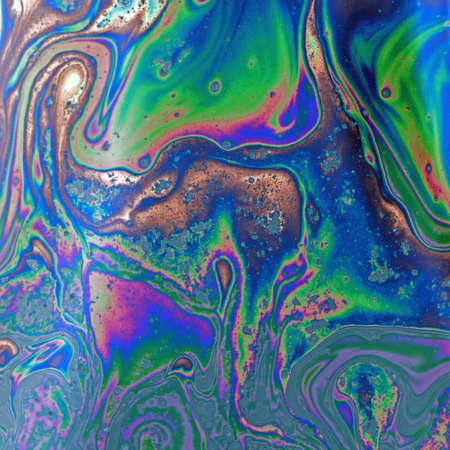 Psychedelic abstract formed by light interference on the surface of a soap bubbleの写真素材