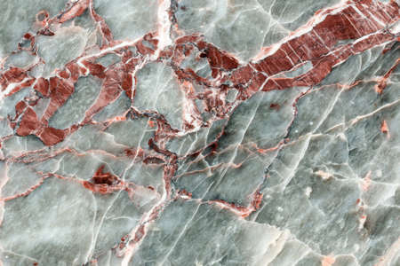 Closeup of polished red and gray natural stone, granite, marbleの写真素材