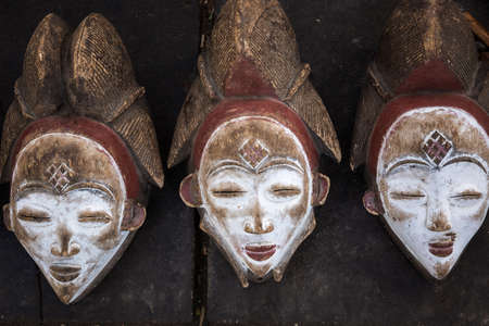 African wooden masks on the market. Souvenirs of Namibia.の写真素材
