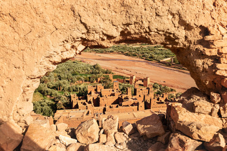View of the Onila River Valley through a hole in the wall of the Ancient Kasbah at Ait Ben Haddou,...