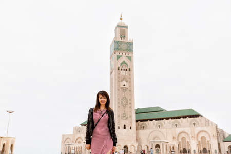 A tourist girl near the Hassan II Mosque in Casablanca, Morocco.の写真素材