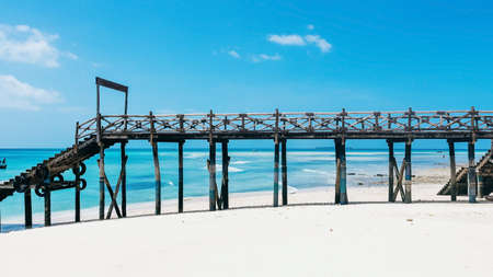 Wooden pier on Prison Island near Zanzibar. Beautiful turquoise water and white sand. Zanzibar. Tanzaniaの写真素材