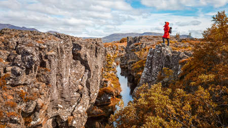 Girl tourist looks at the canyon.Iceland.の写真素材
