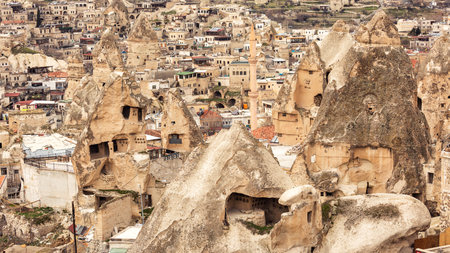 View of the mosque and rock cave houses in Cappadocia. Turkeyの写真素材