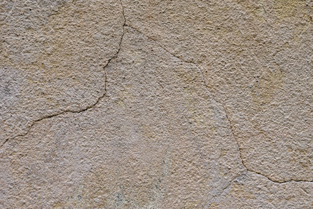 A fragment of a wall with cracks. texture, wall backgroundの写真素材