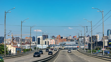 A road with cars on the background of the city of Kyiv. Ukraine
