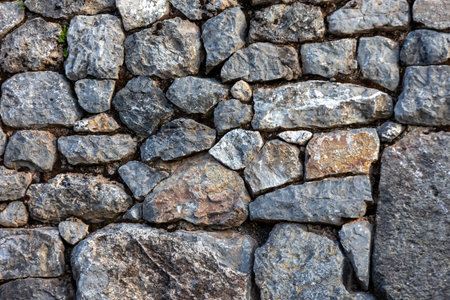 Background of stones. Masonry from stones of different sizesの写真素材