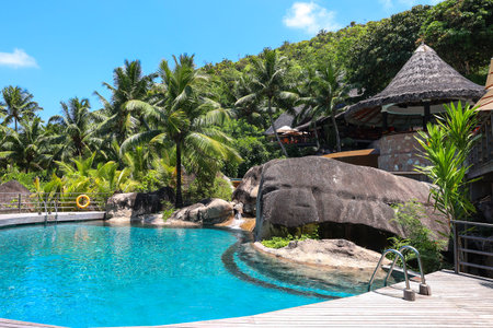 Luxury resort with a swimming pool in a tropical paradiseの写真素材