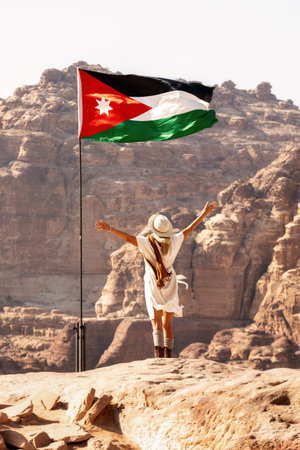 Adventurous Woman Overlooking Desert Mountainsの写真素材