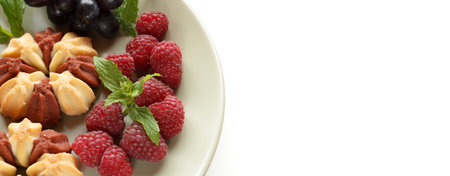 Biscuit with fresh berries on white plate. Selective focus