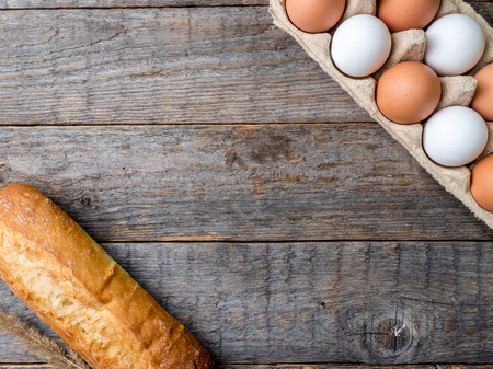 Ingredients for Breakfast Oatmeal Eggs Bread Apple Rustic Wooden background.の写真素材