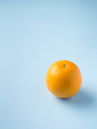 Fresh fruit Orange isolated on blue backgroundの写真素材