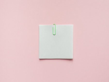 Business flat lay with copy space on a background pink Notebooks to write text stickers Pencil,...