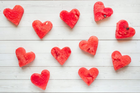 Hearts carved out of watermelon. Concept of Valentine's day.