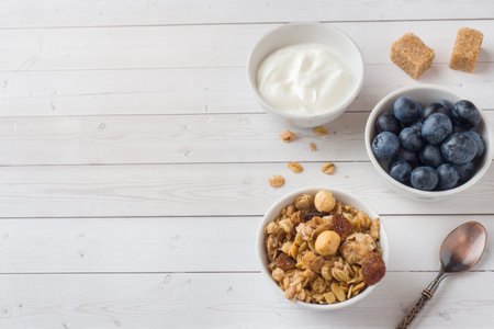 Oat flakes, granules and nuts muesli with blueberries. The concept of healthy food, Breakfast