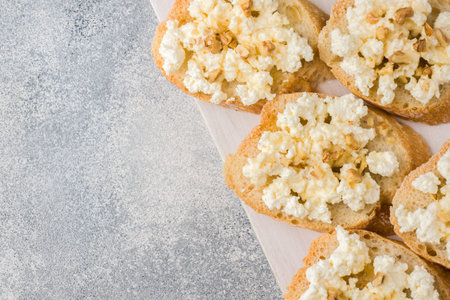 Snack bruschetta with cottage cheese, walnut and honey.
