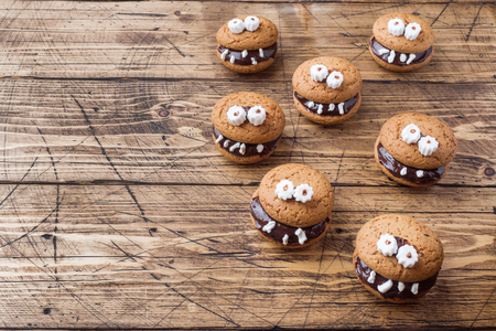 Cookies with chocolate paste in the form of monsters for Halloween.の写真素材