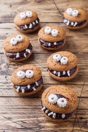 Cookies with chocolate paste in the form of monsters for Halloween.の写真素材