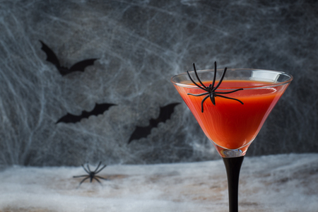 Bloody Mary cocktail, spider web background and bats for Halloween, selective focus.の写真素材