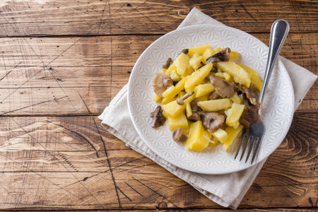 Fried potatoes with mushrooms and onions.の写真素材
