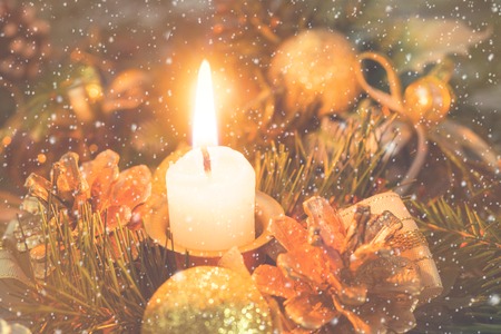 New year's concept. Christmas decorations with candle Christmas tree cones decoration.の写真素材