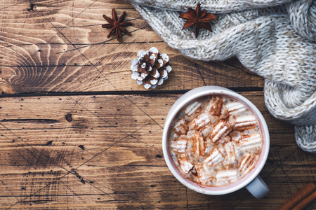 Christmas composition. Hot chocolate and cookies, pine branches, cinnamon sticks and anise stars. Christmas winter concept. Flat lay top view.の写真素材