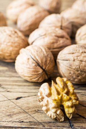 Walnuts on dark vintage wooden background. Walnut healthy food.の写真素材