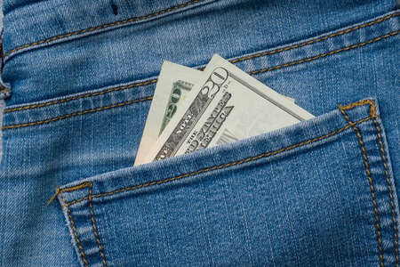 Jeans pocket with twenty dollars banknotes.の写真素材