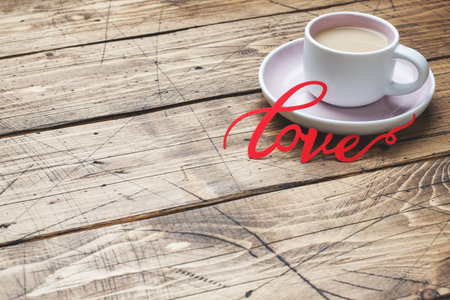 Concept Valentine's Day. Coffee Cup on wooden table, Copy space.
