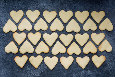 Heart shaped cookies for valentine's day on dark background. Close up.
