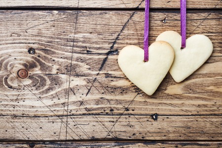 Heart shaped cookies for valentine's day on wooden background. Copy space.の写真素材
