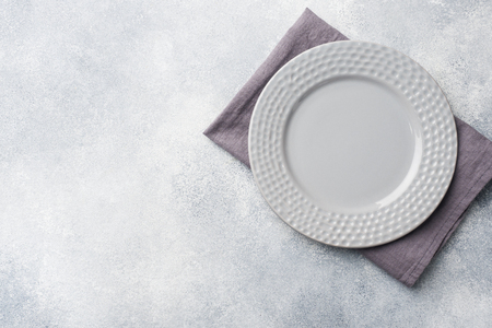 Empty plate on cement background. Top view with copy space.の写真素材