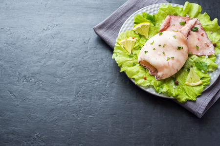 Boiled whole squid on a plate. Seafoodの写真素材