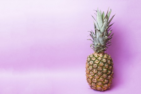 Ripe pineapple on a pink toned background. Copy space.の写真素材