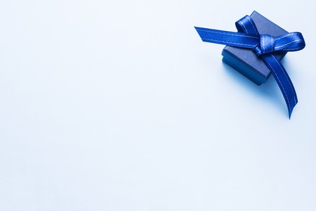 Present blue box on light background greeting card holidays concept. Copy space.の写真素材