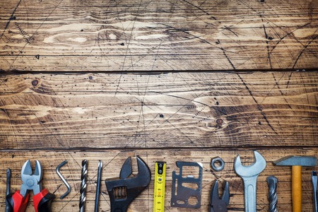 Set of different repair tools on wooden background with copy spaceの写真素材