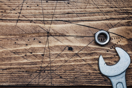 Wrench on wooden background with copy space. Repair toolsの写真素材