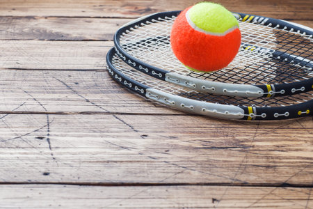 Tennis Ball and rackets on Wood Background, Sport Concept and Idea, Rustic Style