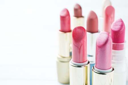 Set of colored pink lipsticks on whiteの写真素材