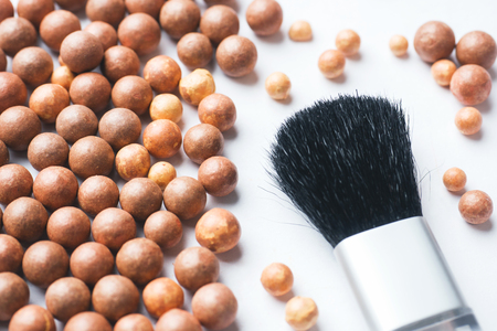 Balls blush and a cosmetic brush. Selective focusの写真素材