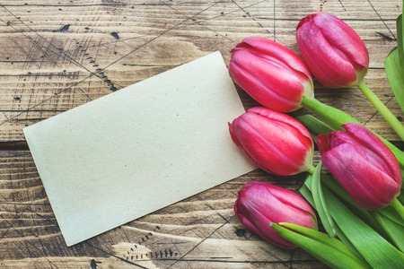 right pink purple tulips on wooden background with copy spaceの写真素材