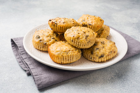 Oatmeal vegetarian muffins with blueberries and nuts on a plate Concept healthy Breakfast.