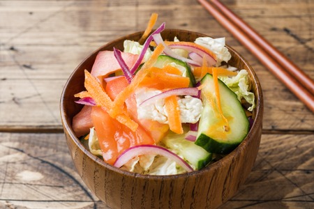 Vegetarian salad of raw fresh vegetables in a plate. Concept healthy eatingの写真素材