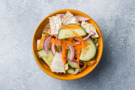 Vegetarian salad of raw fresh vegetables in a plate. Concept healthy eatingの写真素材