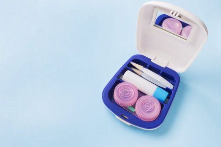 Travel kit for contact lenses, tweezers and containers for moisturizing solution and drops. Copy...